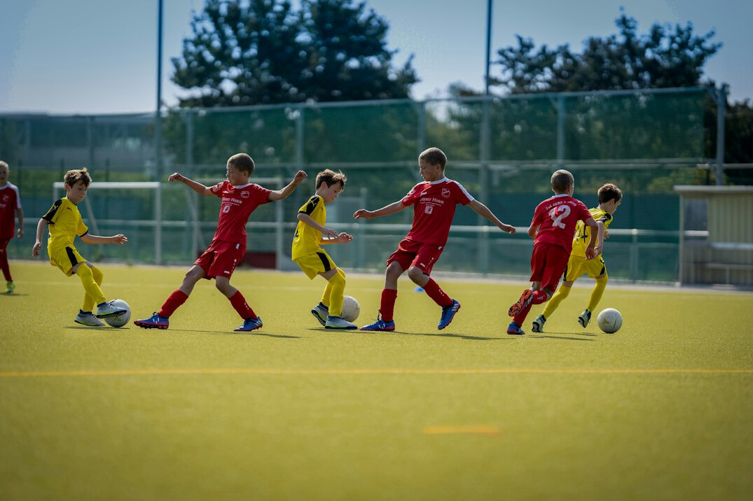 young kids playing soccer